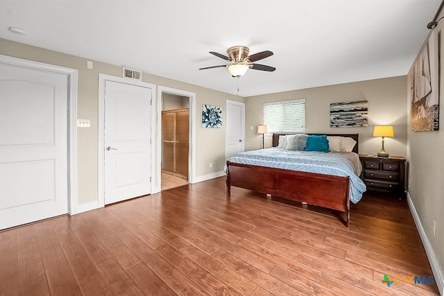 bedroom with ceiling fan, visible vents, baseboards, ensuite bath, and light wood-style flooring