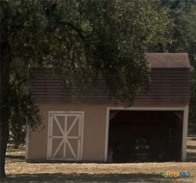 view of outdoor structure featuring a garage