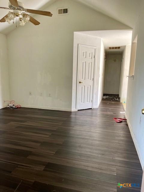 501 San Antonio St, Marlin, TX 76661 - spare room with vaulted ceiling, ceiling fan, and dark wood-style floors