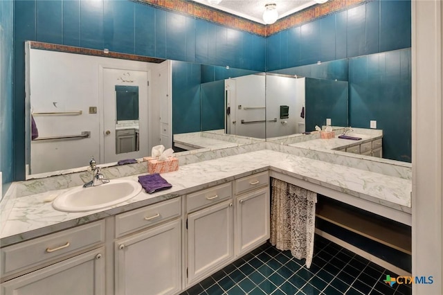 925 Eden Roc St, Victoria, TX 77904 - bathroom with tile patterned flooring and double vanity