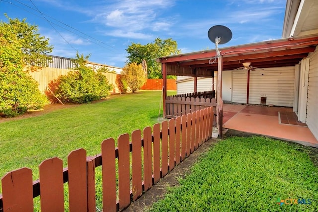 925 Eden Roc St, Victoria, TX 77904 - fenced backyard with ceiling fan and a patio area