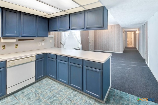 925 Eden Roc St, Victoria, TX 77904 - kitchen with white dishwasher, light countertops, and blue cabinets