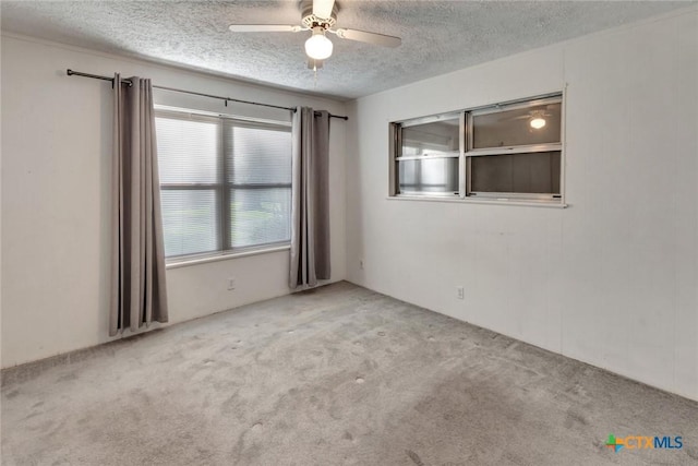 925 Eden Roc St, Victoria, TX 77904 - spare room with a textured ceiling, ceiling fan, and carpet floors