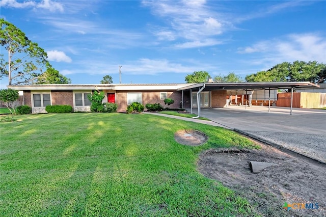 925 Eden Roc St, Victoria, TX 77904 - ranch-style house with a carport, brick siding, and concrete driveway