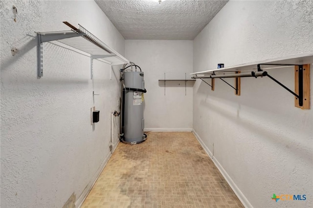 925 Eden Roc St, Victoria, TX 77904 - walk in closet featuring electric water heater
