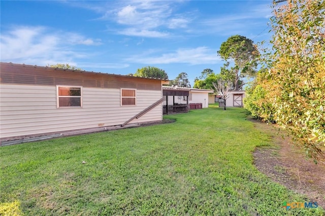 925 Eden Roc St, Victoria, TX 77904 - view of grassy yard featuring an outbuilding