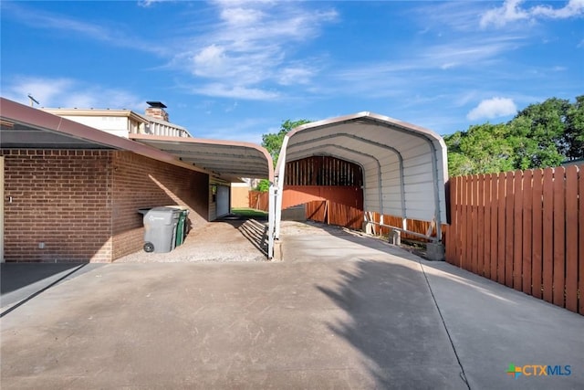925 Eden Roc St, Victoria, TX 77904 - view of patio with a detached carport and concrete driveway