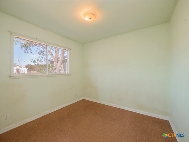 spare room with parquet floors