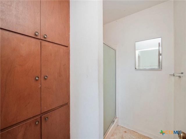 bathroom featuring an enclosed shower