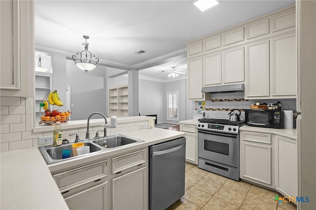 214 Belmoor Ln, Victoria, TX 77904 - kitchen featuring stainless steel appliances, crown molding, tasteful backsplash, a peninsula, and light countertops