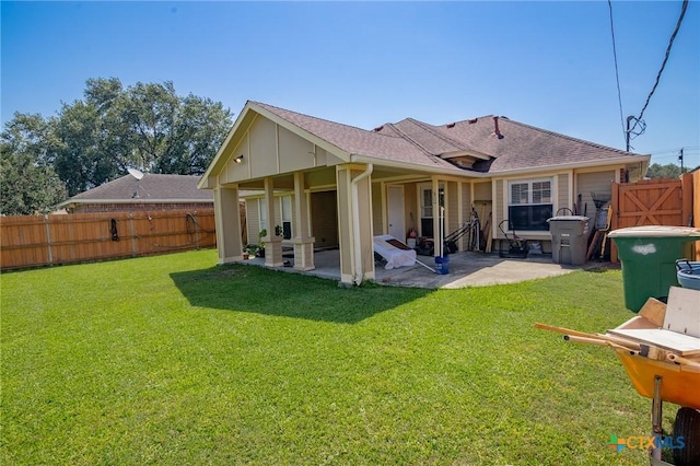 214 Belmoor Ln, Victoria, TX 77904 - back of house with a patio, a fenced backyard, roof with shingles, and board and batten siding