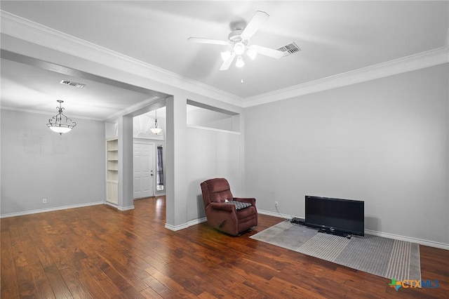 214 Belmoor Ln, Victoria, TX 77904 - living area with wood finished floors, ornamental molding, a ceiling fan, and built in features