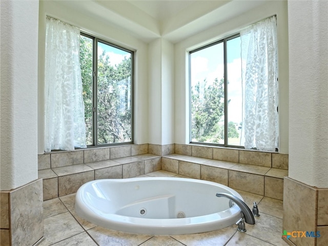 bathroom featuring tiled tub