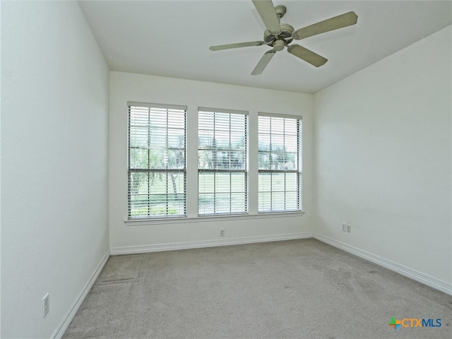 carpeted empty room with ceiling fan