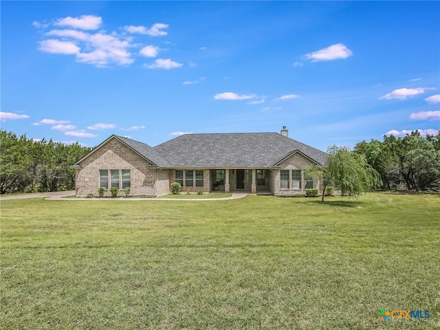 ranch-style home with a front lawn