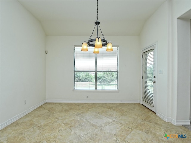 unfurnished dining area with an inviting chandelier and vaulted ceiling