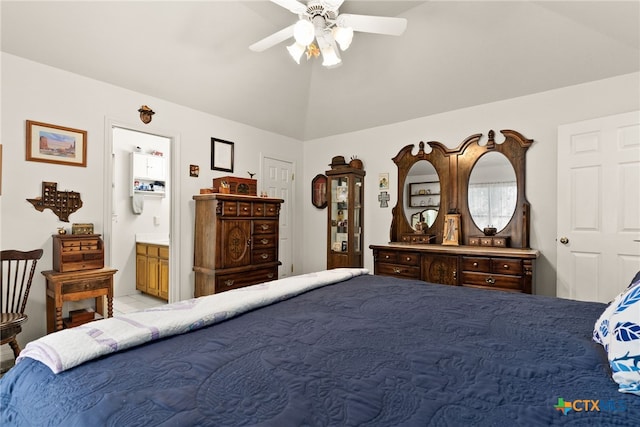 bedroom featuring ensuite bathroom, vaulted ceiling, and ceiling fan