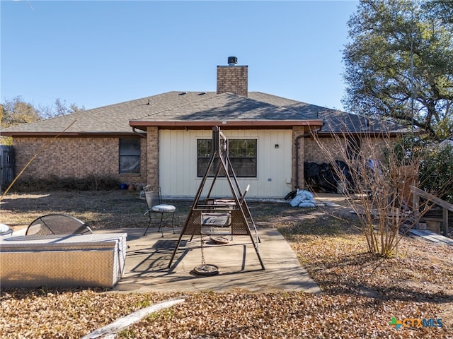 rear view of property with a patio area