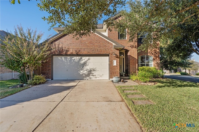 front facade with a garage and a front yard