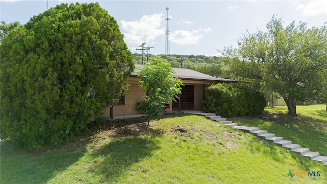 501 Geri Dr, Copperas Cove, TX 76522 - view of front facade with a front yard and brick siding