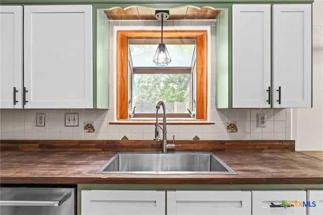 501 Geri Dr, Copperas Cove, TX 76522 - kitchen with tasteful backsplash, white cabinets, and wood counters