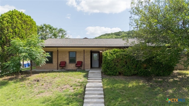 501 Geri Dr, Copperas Cove, TX 76522 - single story home featuring brick siding, a front lawn, roof with shingles, and covered porch