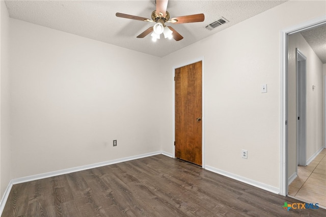 501 Geri Dr, Copperas Cove, TX 76522 - spare room featuring wood finished floors, ceiling fan, and a textured ceiling