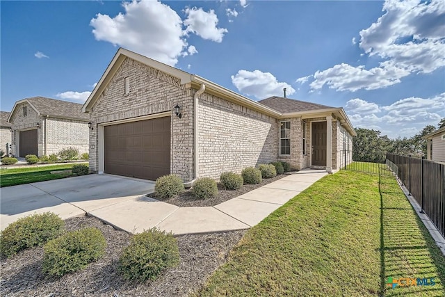 view of front of house with a garage and a front lawn