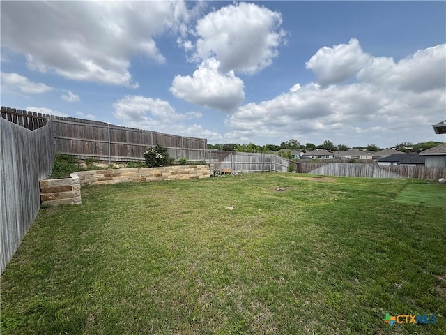 view of yard featuring a fenced backyard