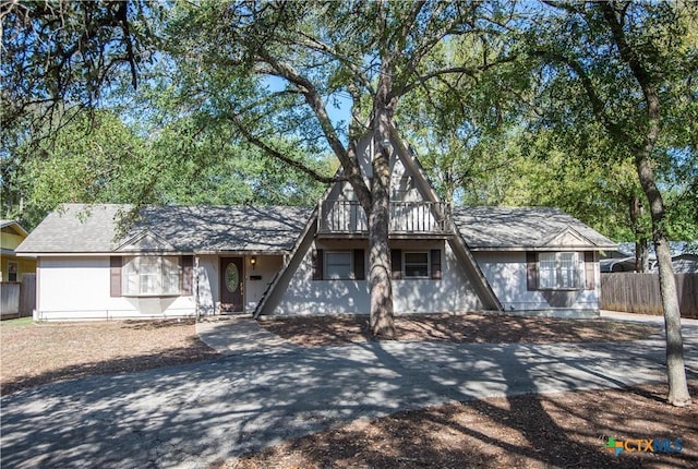 view of front of property featuring fence