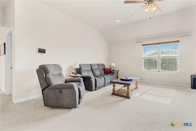 carpeted living room featuring ceiling fan and lofted ceiling