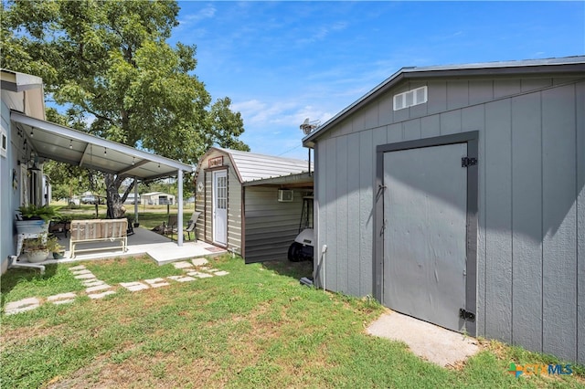 view of yard featuring a patio area and a storage unit