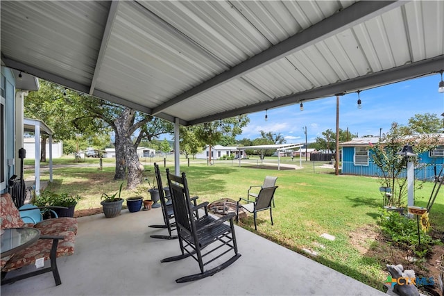 view of patio with a fire pit