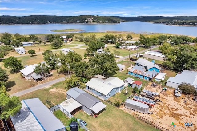 drone / aerial view with a water and mountain view