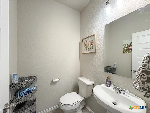 bathroom with sink and toilet