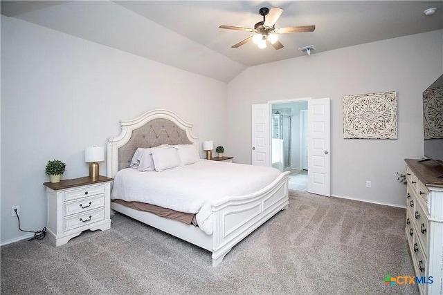 carpeted bedroom with vaulted ceiling and ceiling fan