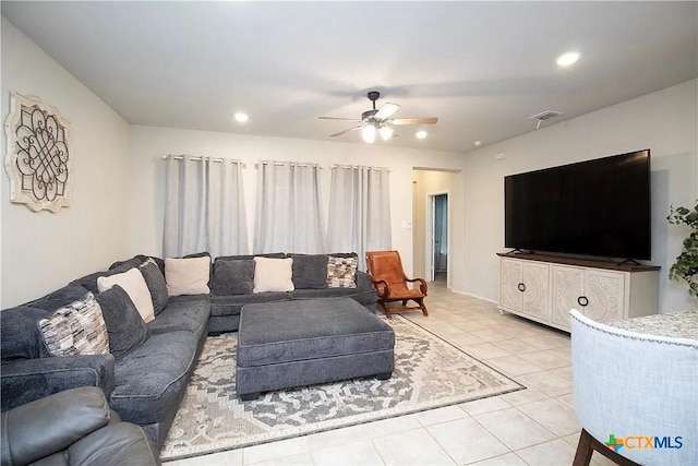 tiled living room featuring ceiling fan