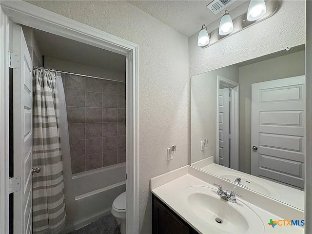 full bathroom with shower / bathtub combination with curtain, vanity, and toilet