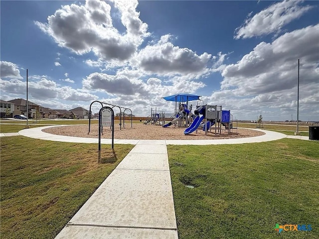 view of jungle gym featuring a lawn