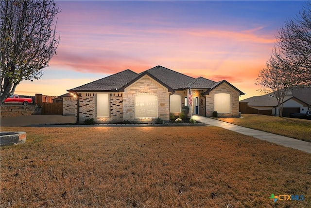 view of front of property with a lawn