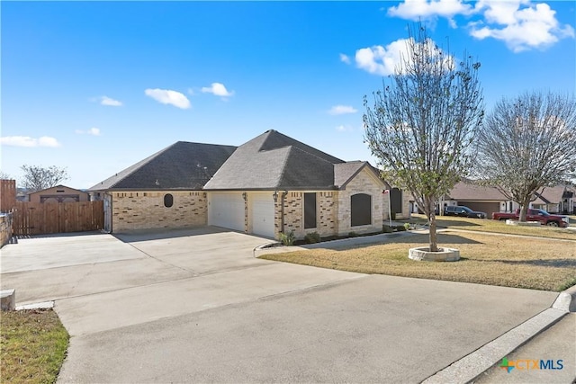 view of front facade with a front yard and a garage