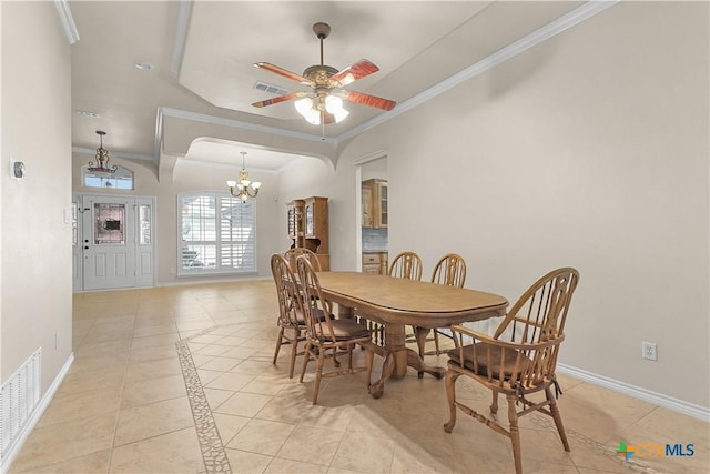 dining room with light tile patterned flooring, ceiling fan with notable chandelier, and ornamental molding