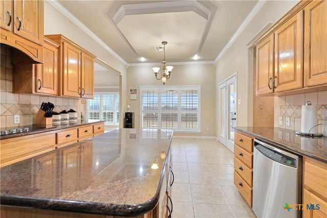 kitchen featuring an inviting chandelier, a kitchen island, dishwasher, and tasteful backsplash