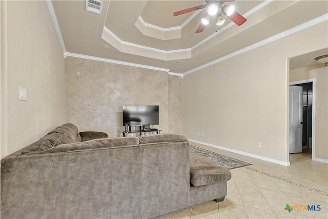 unfurnished living room with ceiling fan, tile patterned floors, a tray ceiling, and ornamental molding