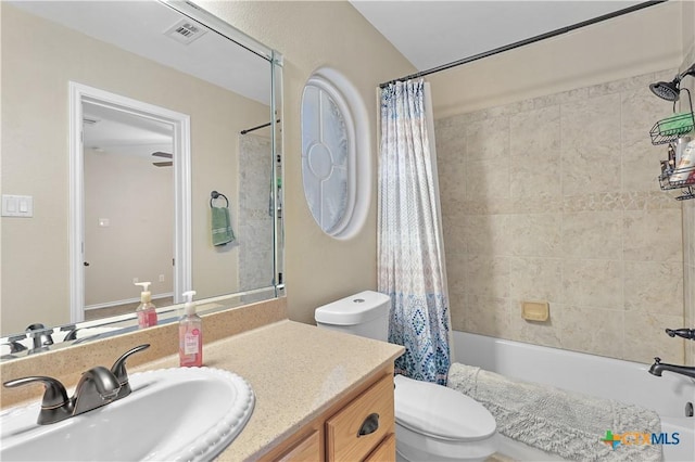 full bathroom featuring toilet, vanity, and shower / bath combo with shower curtain