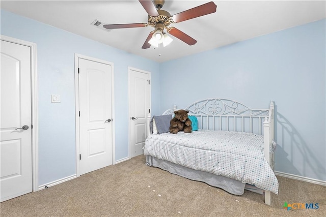 carpeted bedroom with ceiling fan