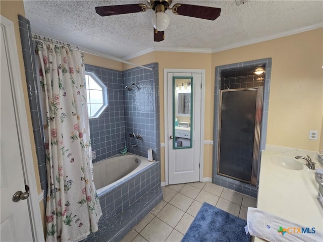 full bath featuring ornamental molding, tiled shower / bath, a textured ceiling, tile patterned floors, and a ceiling fan