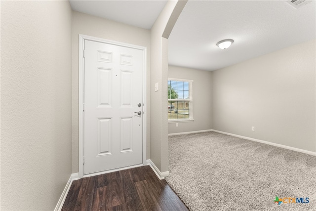 doorway to outside featuring dark hardwood / wood-style floors