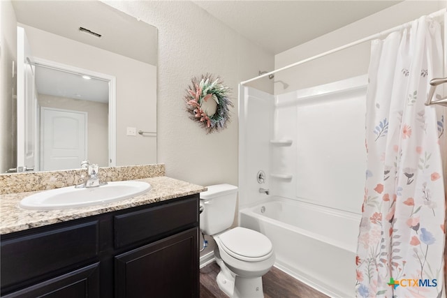 full bathroom featuring wood-type flooring, vanity, toilet, and shower / bathtub combination with curtain