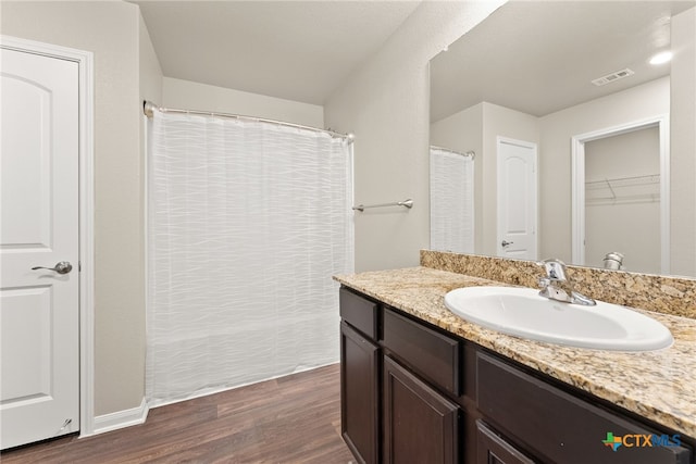 bathroom featuring vanity and hardwood / wood-style flooring